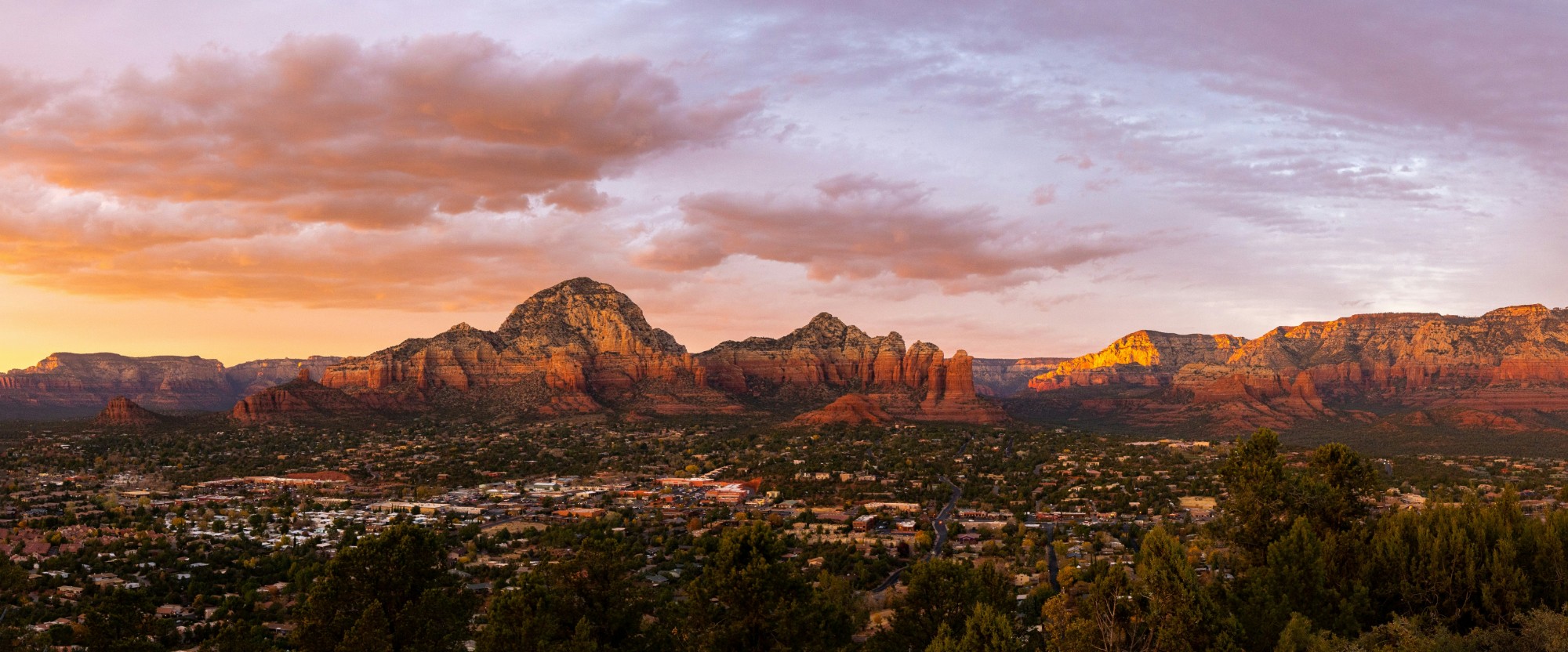 The Sedona valley at sunset, the red rock buttes catching the last light