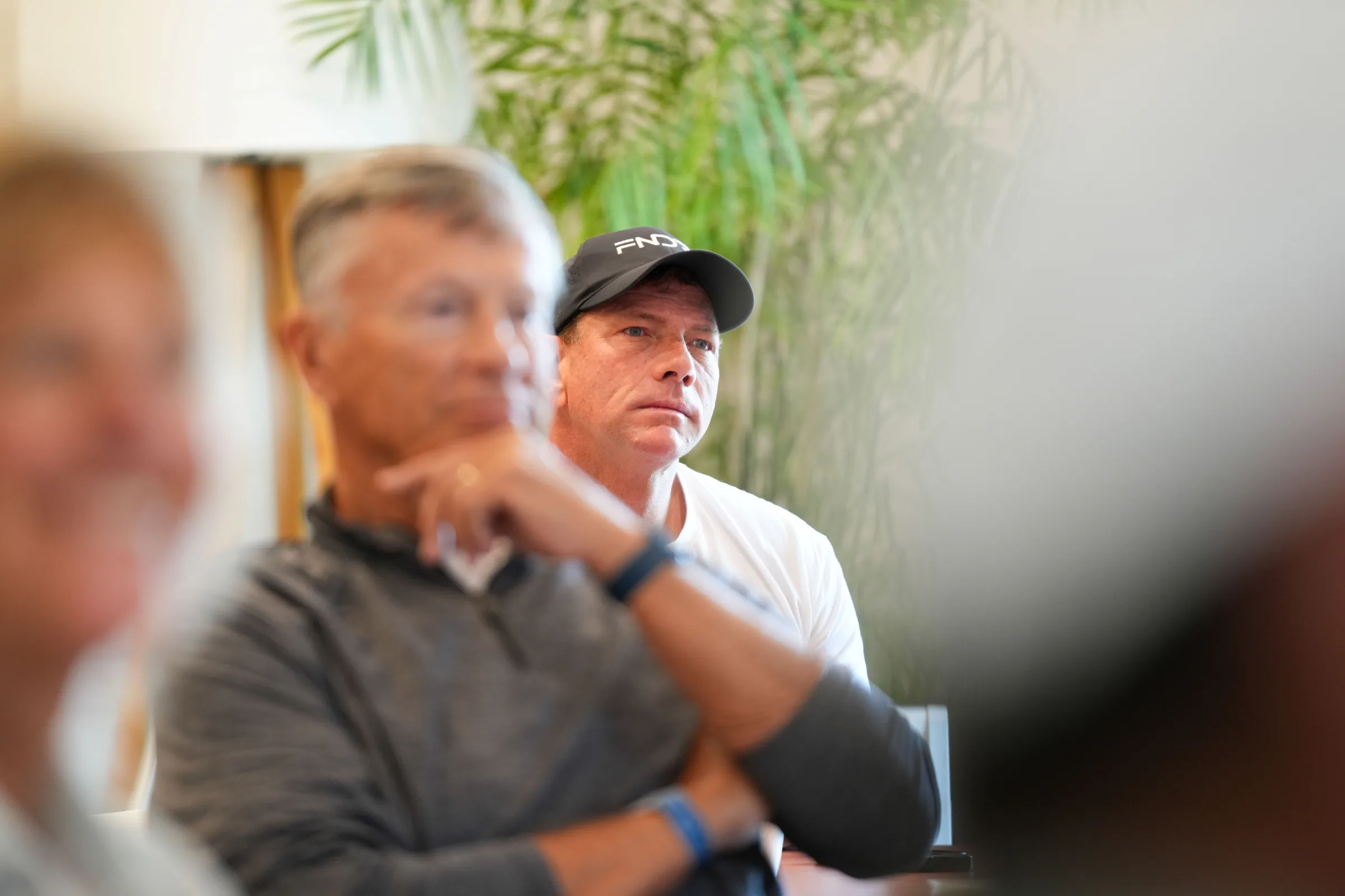 Two business owners listening closely during a FNDRS workshop